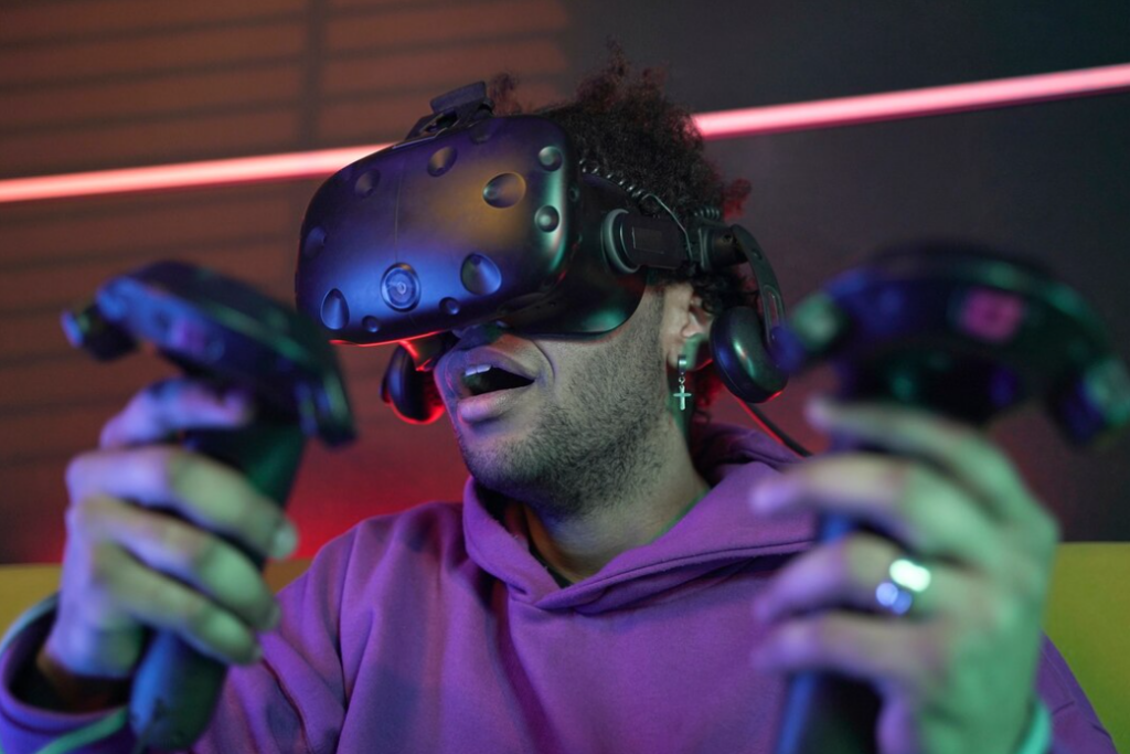 shot of a surprised man wearing VR glasses